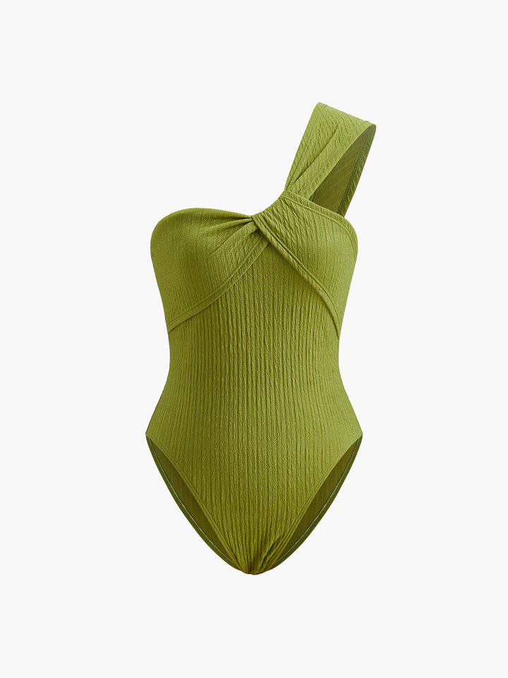 Asymmetric swimsuit with twist & ruching – figure shaping