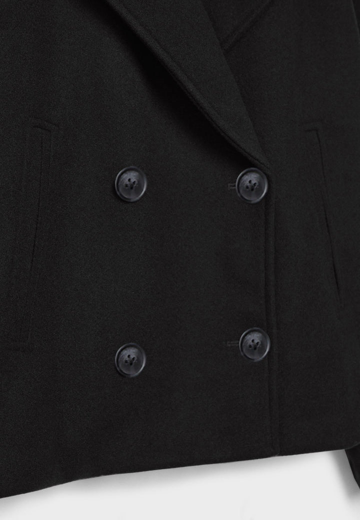 Short women's coat with double row of buttons made of vegan leather