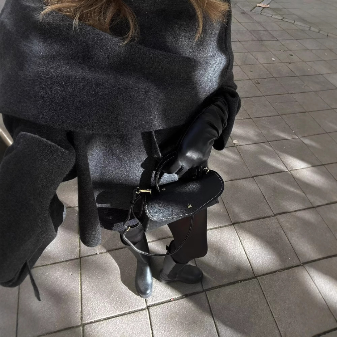 Women's cape coat made of soft fabric with asymmetrical design