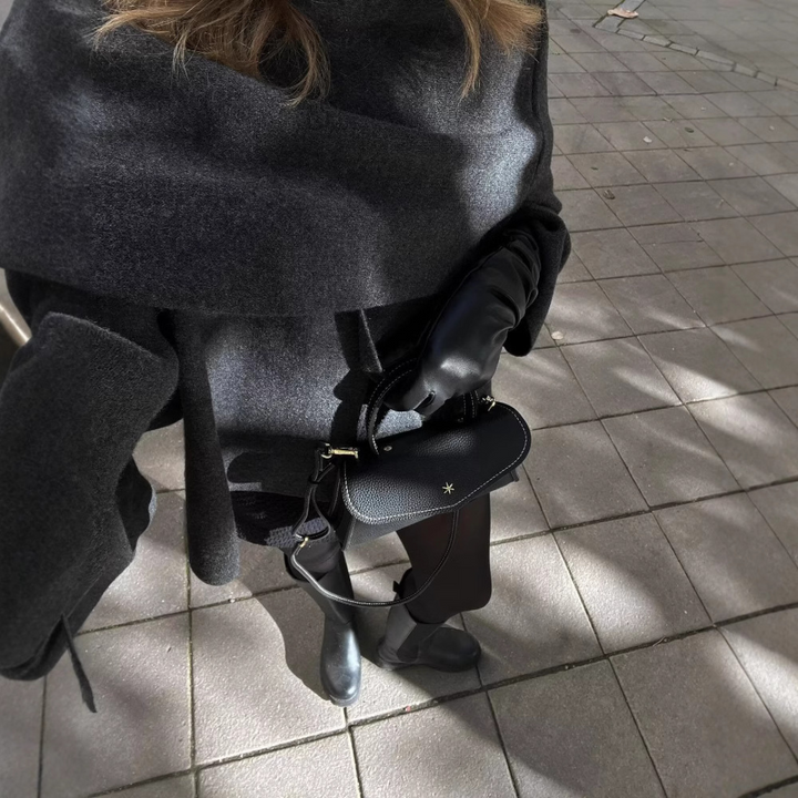 Women's cape coat made of soft fabric with asymmetrical design