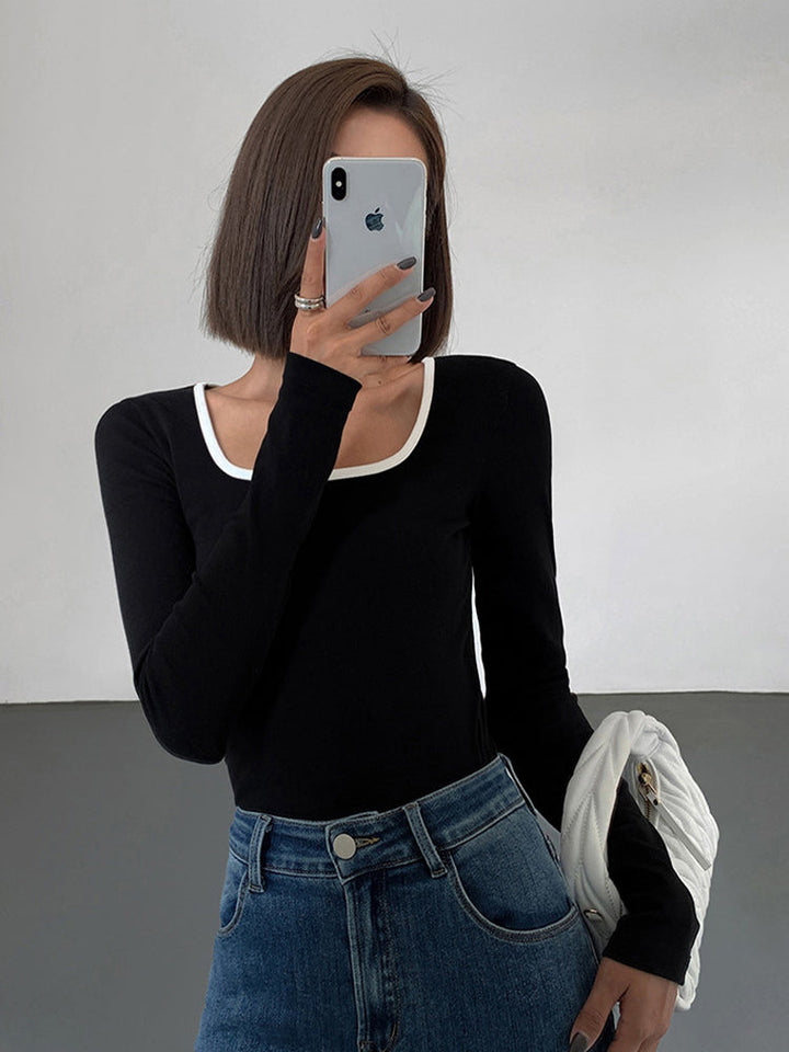 Women's long-sleeve jersey top with contrast neckline
