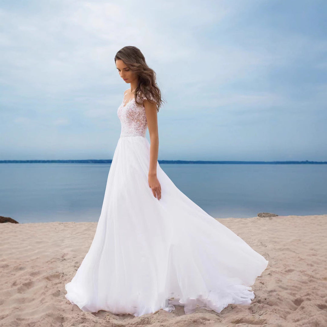 Elegantes, romantisches Brautkleid mit Spitzenoberteil – fließender Rock