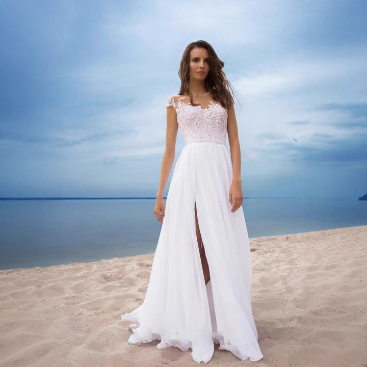 Elegantes, romantisches Brautkleid mit Spitzenoberteil – fließender Rock