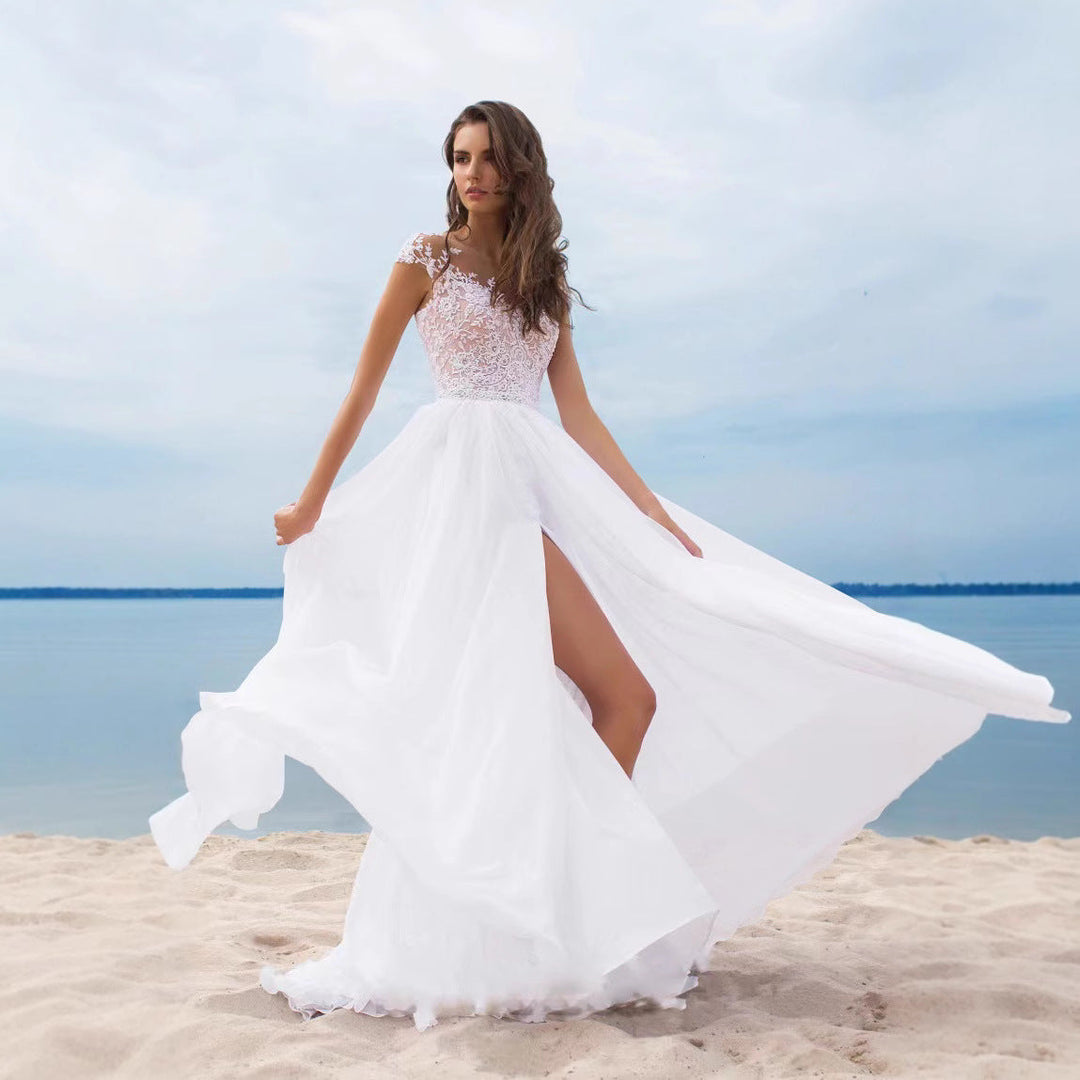 Elegantes, romantisches Brautkleid mit Spitzenoberteil – fließender Rock