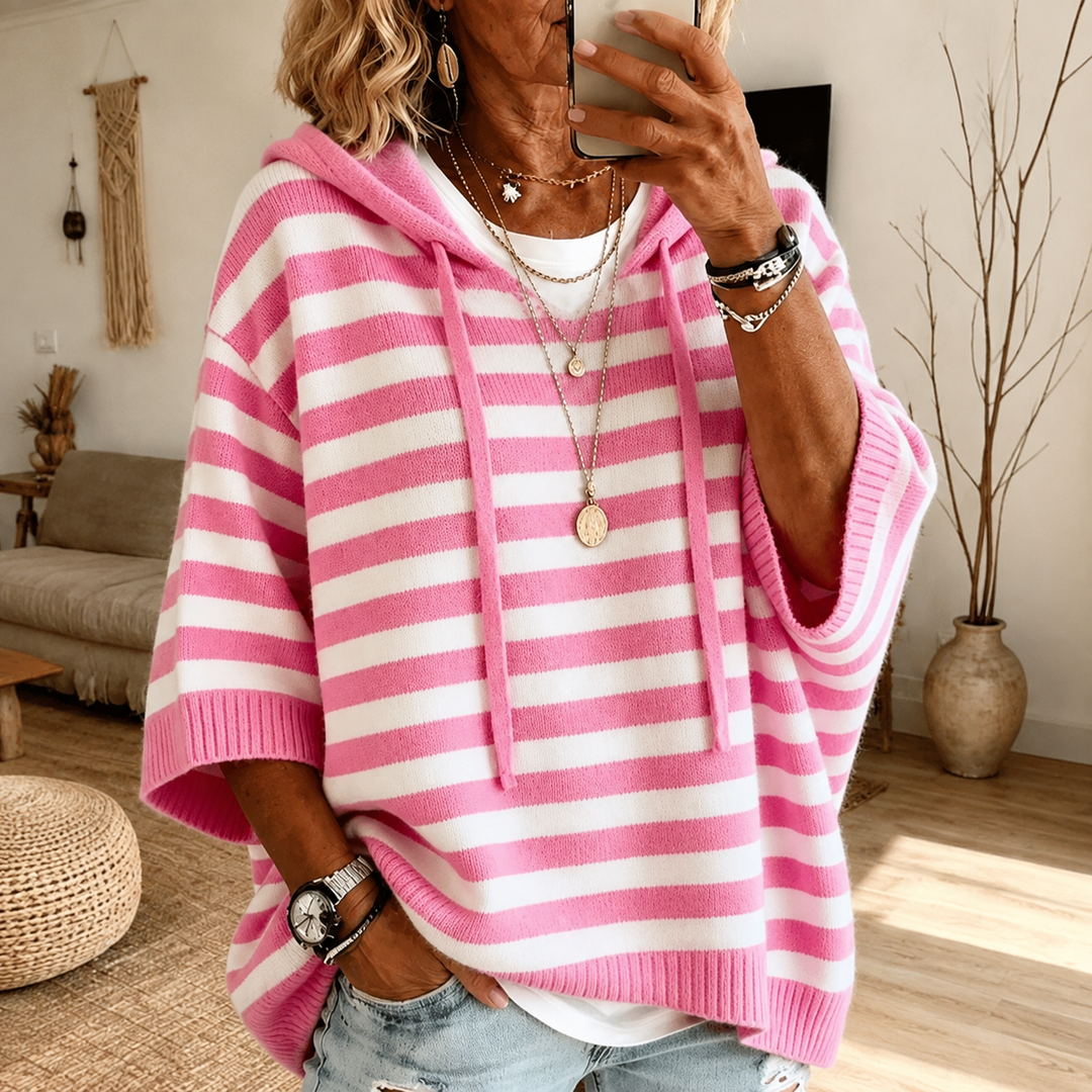 Women's hooded poncho sweater with ribbed trim