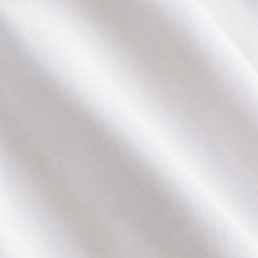 Vela | Baumwollbluse mit Twist-Detail und Wrap-Hem