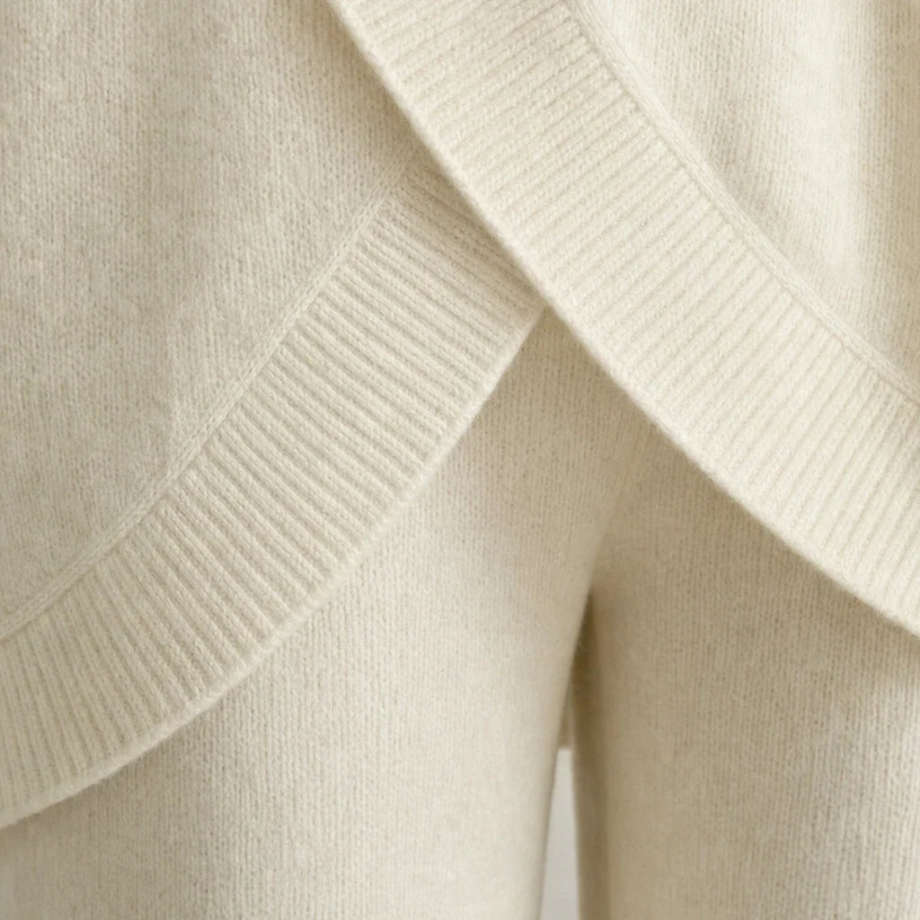 Knit two-piece set with gold buttons and an asymmetrical cut