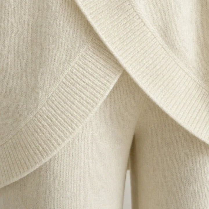 Knit two-piece set with gold buttons and an asymmetrical cut