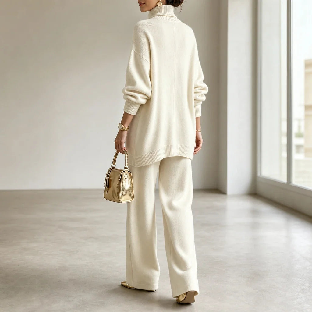 Knit two-piece set with gold buttons and an asymmetrical cut
